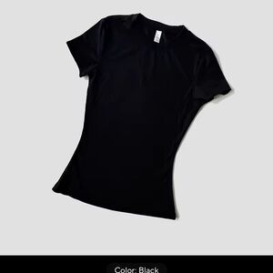 2 brand new compressive T shirts. One black, one purple. Size S